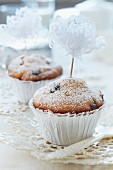 Muffins decorated with flowers hand-crafted from lace ribbon