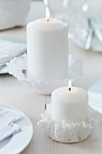 Crocheted doilies moulded into hand-crafted candle holders using fabric stiffener