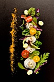 Frühlingssalat mit Sardellenfilets und geriebenem Bottarga