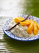 Coconut rice pudding with vanilla and mango
