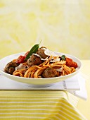 Spaghetti with tomato sauce and veal meatballs