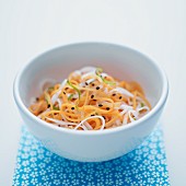 Daikon and carrot salad in a white bowl