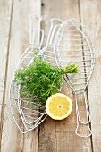 Accessories for grilling fish, dill and lemon