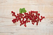 Redcurrants on a wooden surface