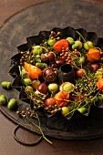 Autumnal arrangement in old baking tin