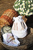 Hand-sewn laundry bag made from white bed linen with patterned fabric inserts and lace trim
