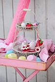 Fruits and cakes hand-crafted from scraps of felt, socks and jersey on wire cake stand