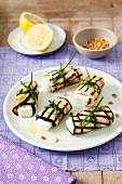 Rolled aubergine slices stuffed with feta