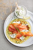 A crepe topped with smoked salmon and creme fraiche (seen from above)
