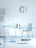Transparency - plexiglass chairs at glass table and table lamps with glass lampshades below spherical, metal pendant lamp
