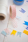 Making decorative flags with masking tape and string