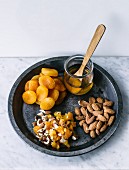 Almonds and dried apricots with honey