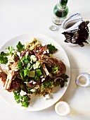 Lamb chops with aubergine purée, parsley and lemon salad