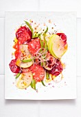 Vegetable salad with apple, grapefruit and onions