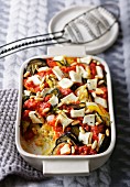 Millet bake with tomatoes, courgette, aubergine, peppers and goat's cheese