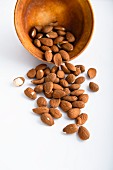Almonds in and next to a bowl