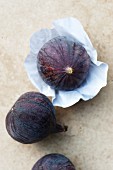 Three figs, one on paper