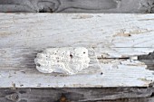 Stone on weathered wooden board