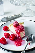 slice of rasberry cheesecake with fresh raspberries