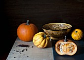 pumpkins on the table with the bowl