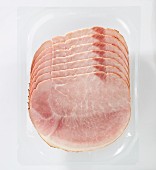 Slices of boiled ham in plastic packaging (view from above)
