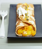 A pancake filled with diced mango
