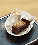 A slice of chocolate cake with pears