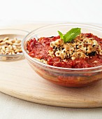 Aubergine gratin with tomato sauce, feta and pine nuts