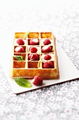 Waffle with lemon cream and fresh raspberries