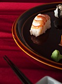 Nigiri sushi (prawn, salmon) and wasabi