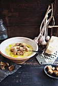 Rustic garlic soup with croutons