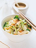 Rice noodles with carrots, pak choi and peanut sauce (Asia)
