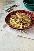Bass fillet with za'atar crust on a salad of green spelt with apples and dates