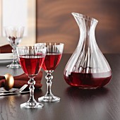 A carafe and glasses of red wine