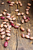 Dried borlotti beans on a wooden surface