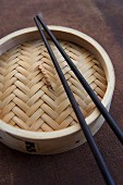 Bamboo steamer with chopsticks