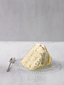 A slice of birthday cake, decorated with silver balls