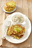 Courgette fritters with mushroom sauce