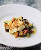 Fried fish fillet on Mediterranean vegetables