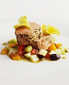 Veal fillet with herbs on mixed vegetables