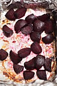 Roasted beetroot on the baking tray with aluminium foil