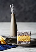 A lamington (cake cube dipped in chocolate and coconut, Australia)