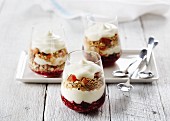 Layered desserts with cereals, fruit and yoghurt