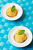 Two scoops of home-made mango sorbet with fresh mint