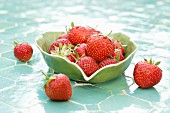 Fresh strawberries in a leaf-shaped bowl