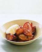 Stewed plums with a dollop of whipped cream