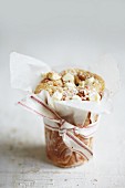 A blondie wrapped in grease-proof paper with a ribbon