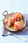 Pears wrapped in bacon, stuffed with Gorgonzola