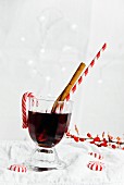 Mulled wine with a cinnamon stick and a drinking straw