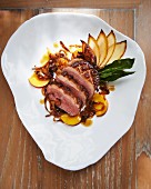 Duck breast with peach and caramelised onions